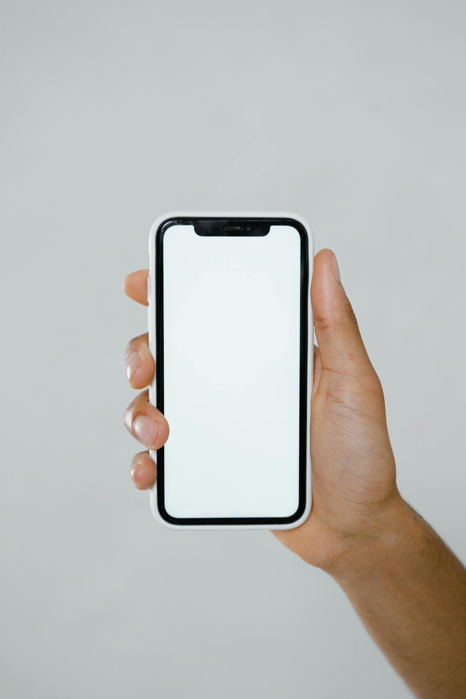 Mobile-responsive local business website on smartphone — AI4WEB builds mobile-first, Google-friendly sites